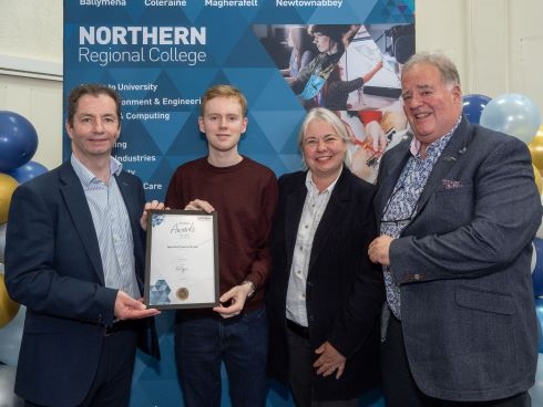 Group holding certificate at awards ceremony